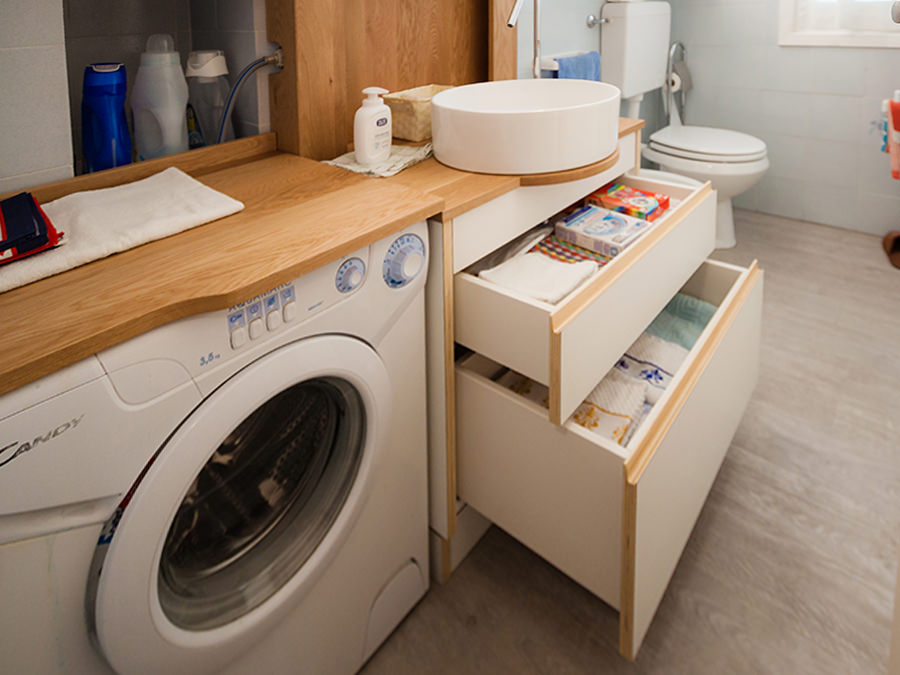 bathroom cabinet with open drawers