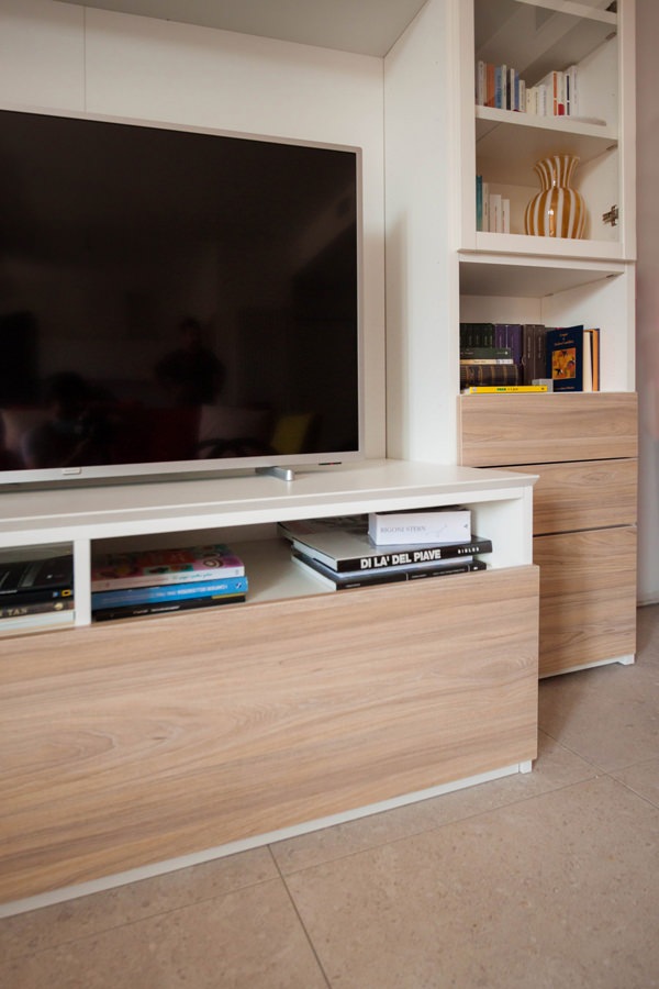 detail of the TV cabinet in the living area in front of the drawers