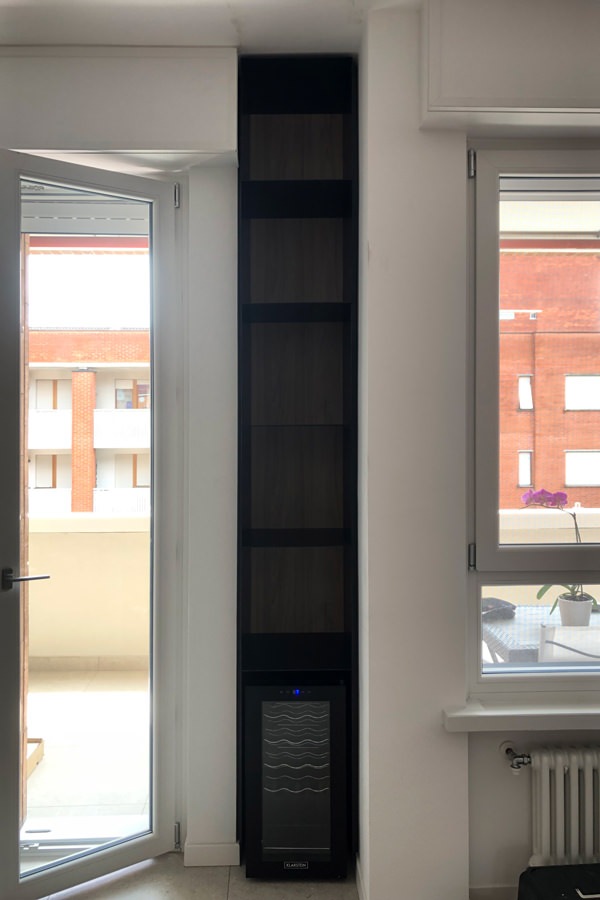 shaped corner cabinet in black iron niche wine cellar