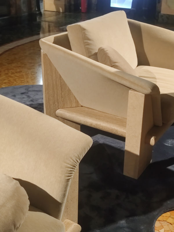 Fuorisalone armchairs travertine structure
