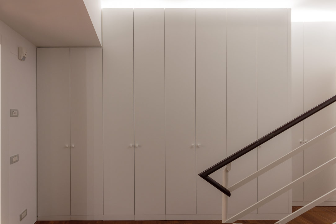 closed cupboards under the stairs